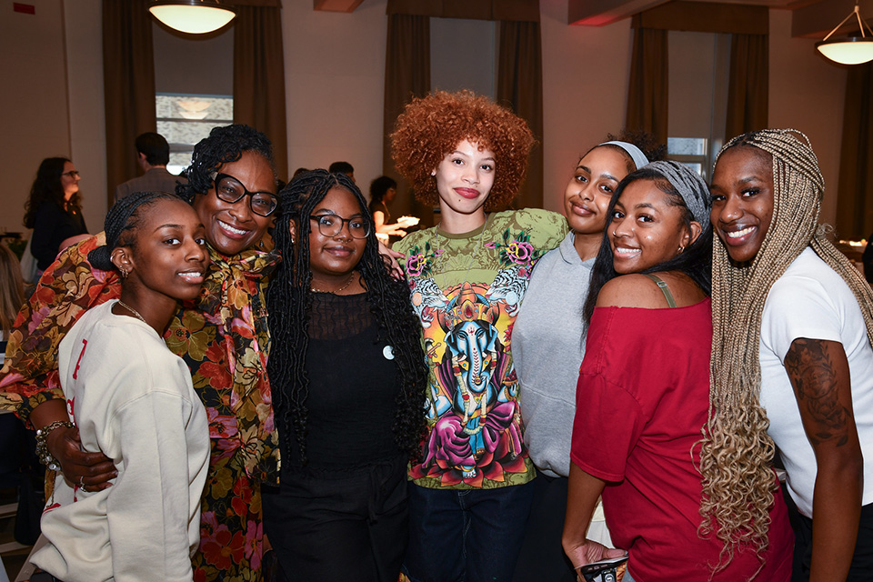 A group of students link arms during Spirit of Identity week at Fisher.