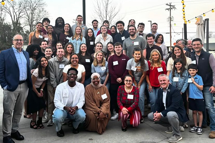 Campus Ministry meet up with alumni during alternative Spring Break service trip.