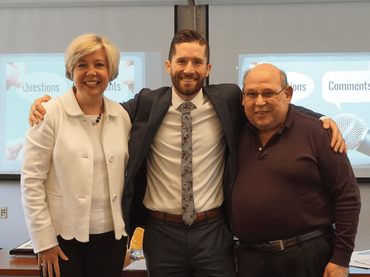 Mitchell Ball with two faculty members smiling at the camera