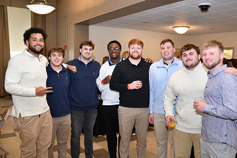 A group of male students at the senior brunch