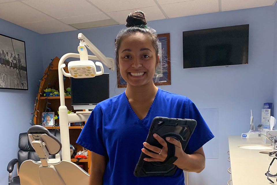 Alexa Montemayor poses at work in a dentist office.