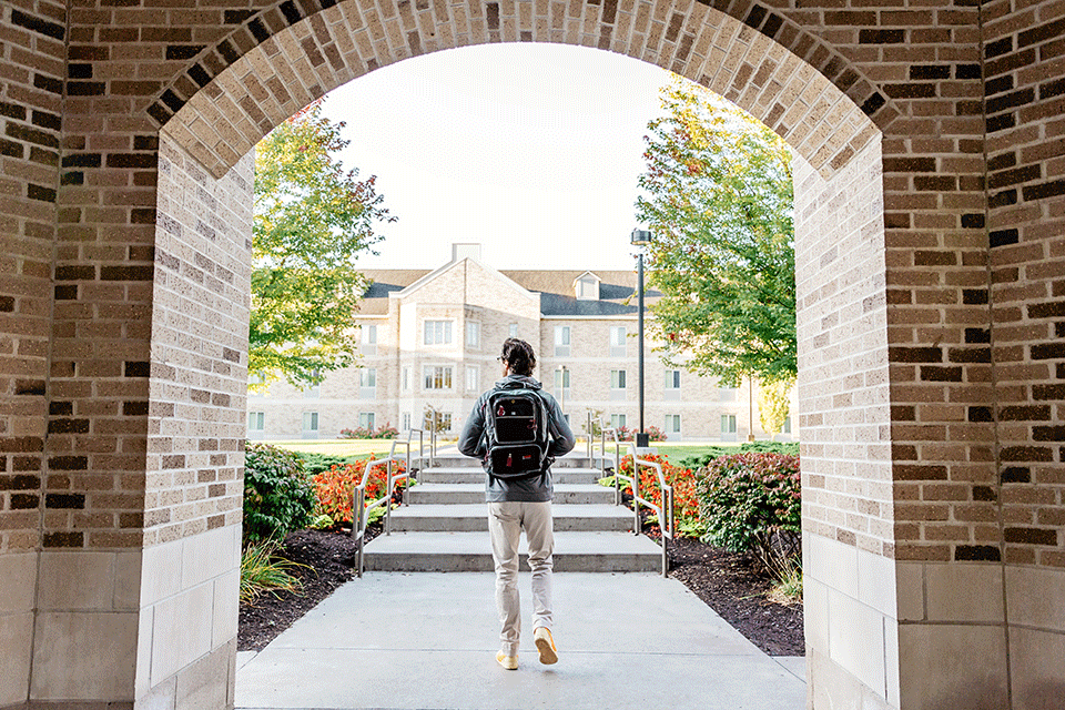 A student walks out of the Campus Center.