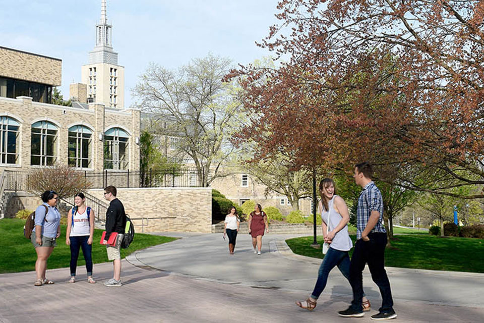 Students walk through LeChase Commons in the spring.