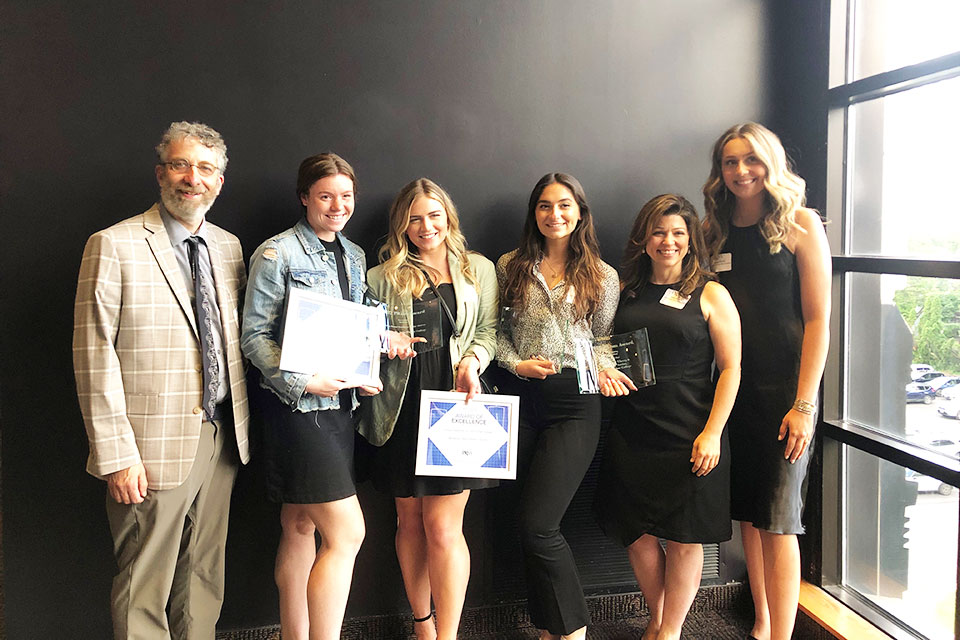 Professors Jeremy Sarachan, Arien Rozelle, and Alyssa Whitley with Fisher students who were awarded PRisms.