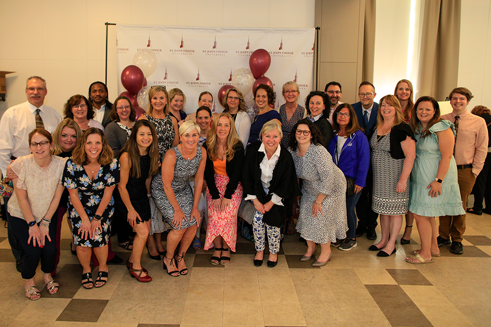 The Wegmans School of Nursing faculty and staff gather for the annual Light Up the Night event.