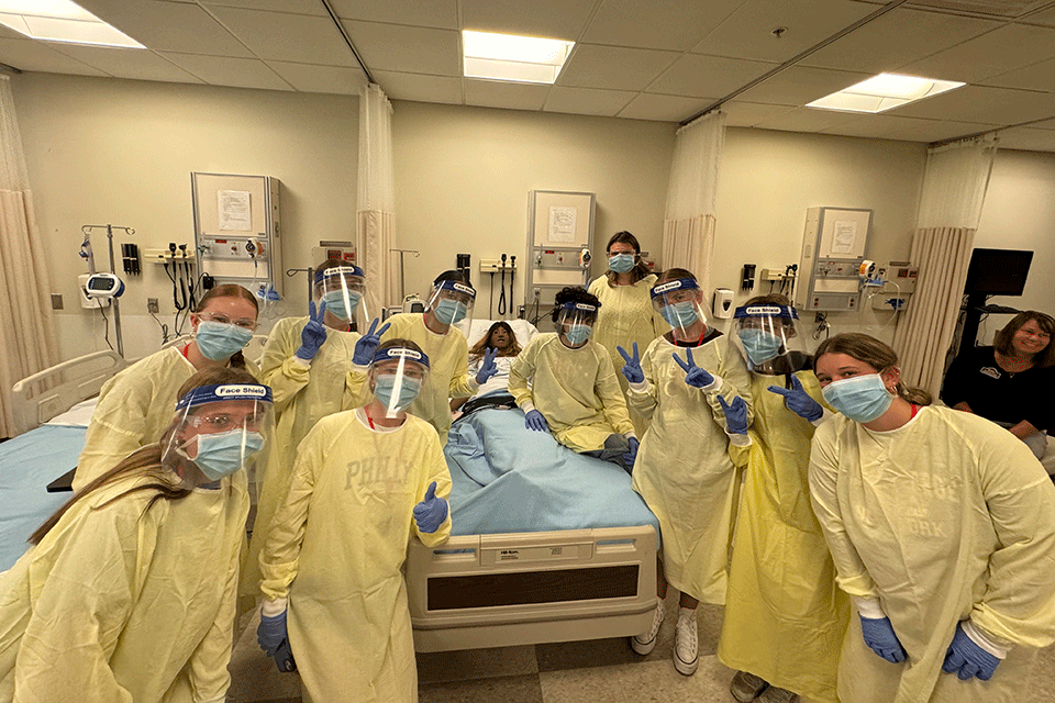 During the 2024 Cardinal Nurse Camp, students suited up in PPE and engaged in a nursing simulation.