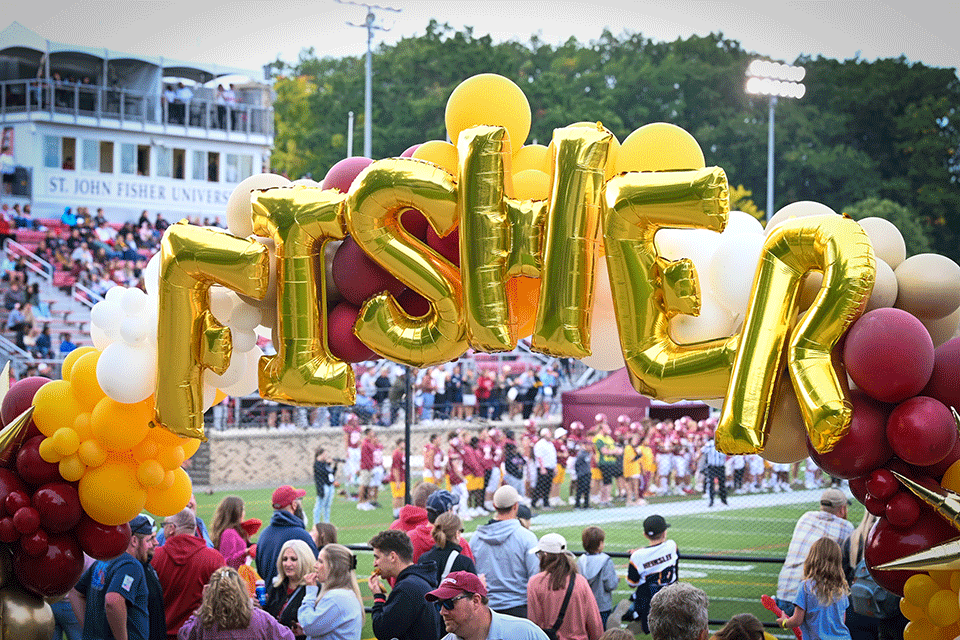 Balloons spell out Fisher.