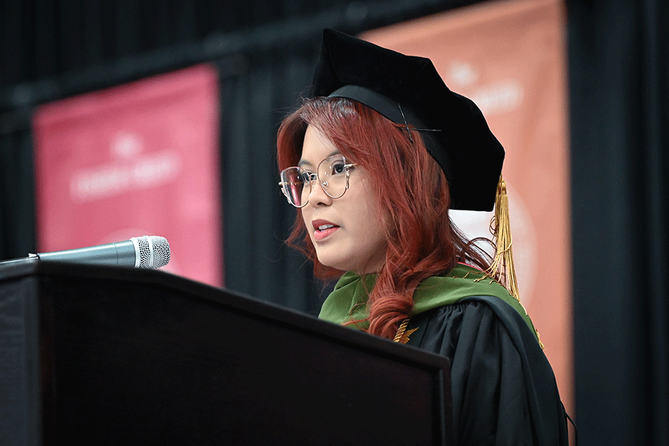 Jamie Cantones Lucresio addresses her fellow graduates at the Wegmans School of Pharmacy Commencement.