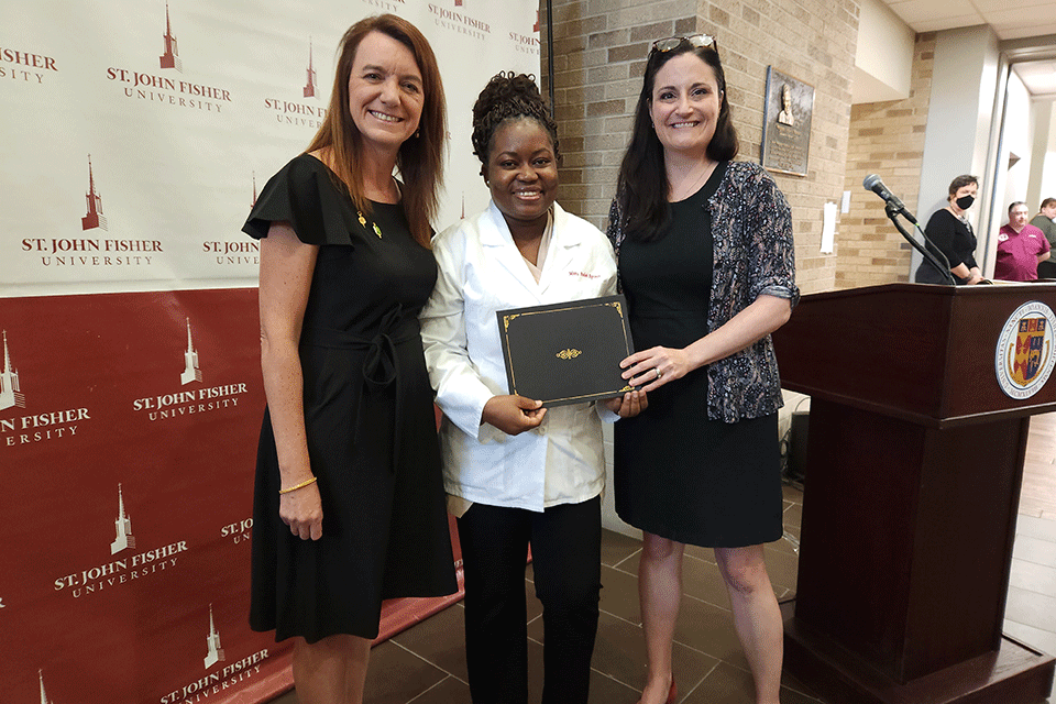 Dean Birnie, a student, and Dr. Amy Parkhill at a School-based awards ceremony.