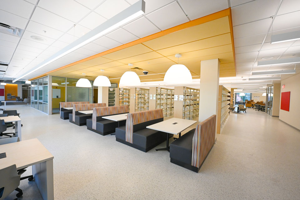 The interior of Lavery Library it outfitted with booths, tables, and bookshelves.
