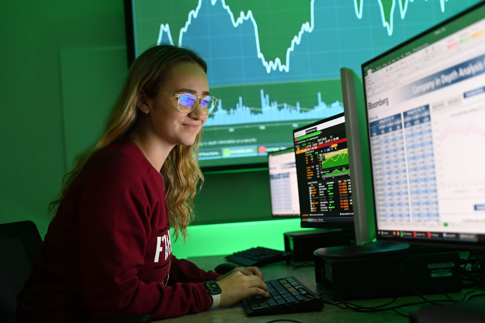 A student works on a Bloomberg Terminal in the School of Business trading lab.