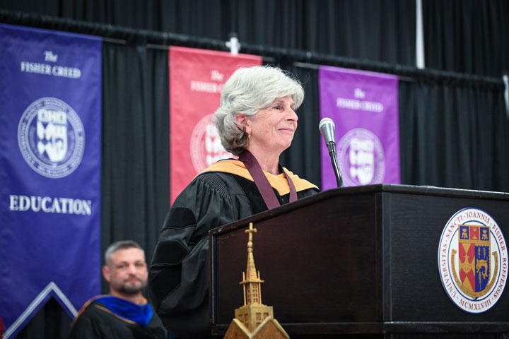 President's Medal recipient Marilyn Dollinger offers remarks at Commencement.