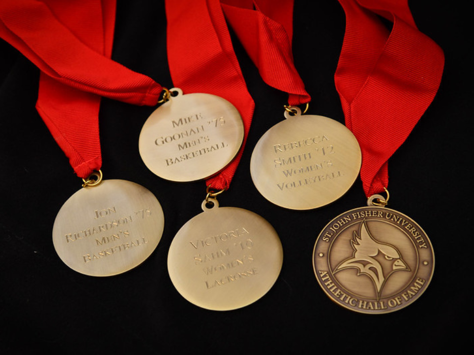 Five medals and ribbons with Fisher logo