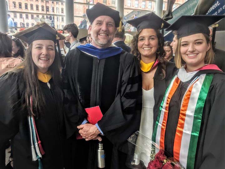 Director Mike Boller with sustainability graduates.