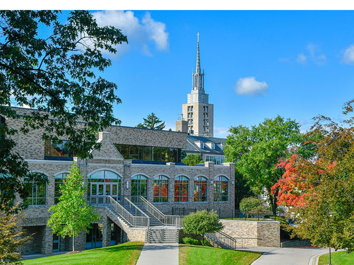 Fall view of Lavery Library with the Kearney Hall steeple in the background.