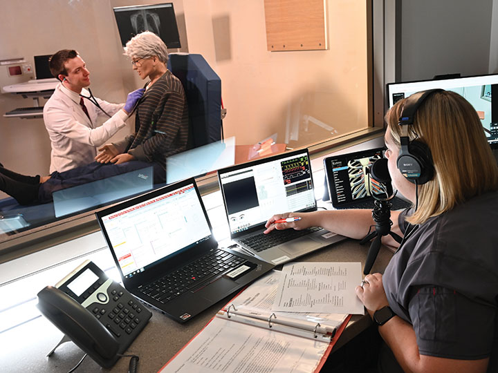 A pharmacy student participates in simulation experiences.