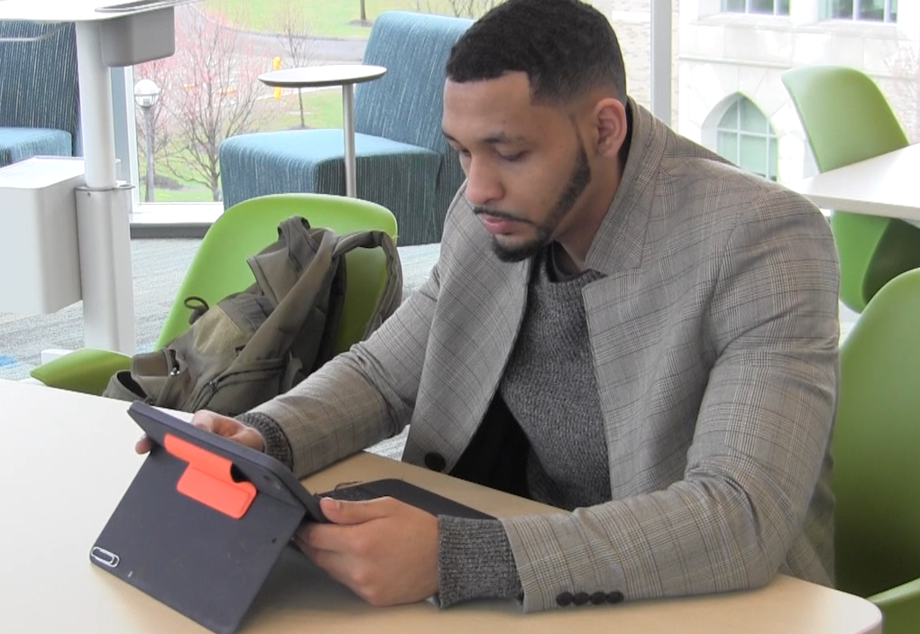 A student works on an iPad during class.