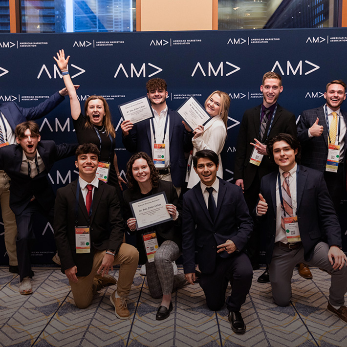 A group of students celebrate as part of the American Marketing Association (AMA) group.