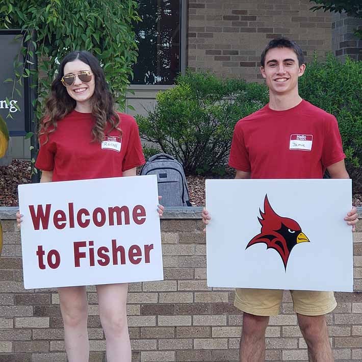 Students holding welcome signs for Great Beginnings.