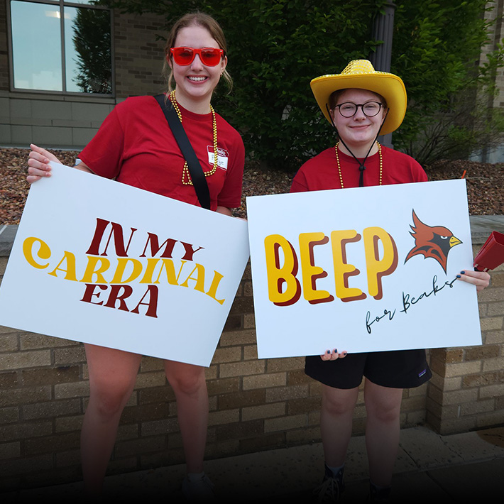 Students holding welcome signs for Great Beginnings.