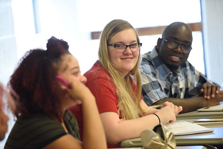 Students seated at desks in a classroom.