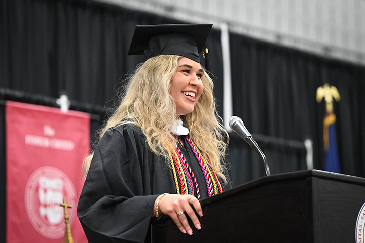 A graduate speaks during Commencement.