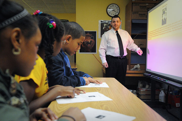 A Fisher graduate teaches in a local classroom.