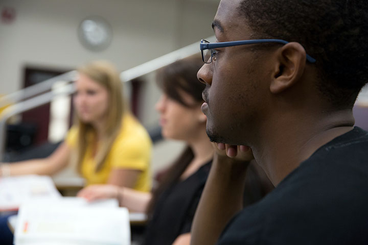 Side view of student face in classroom.