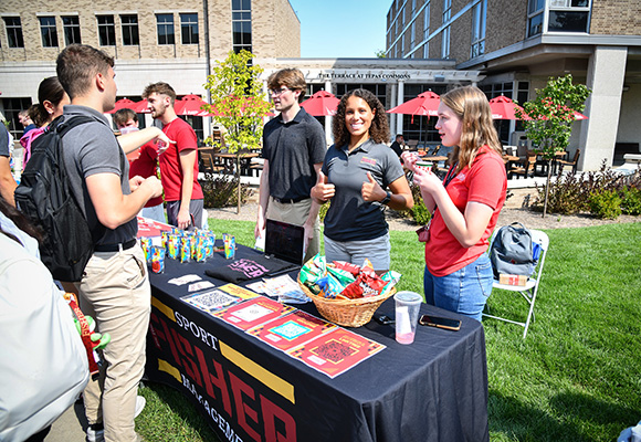 Fisher students recruit for Sport Management club during Involvement Fest.