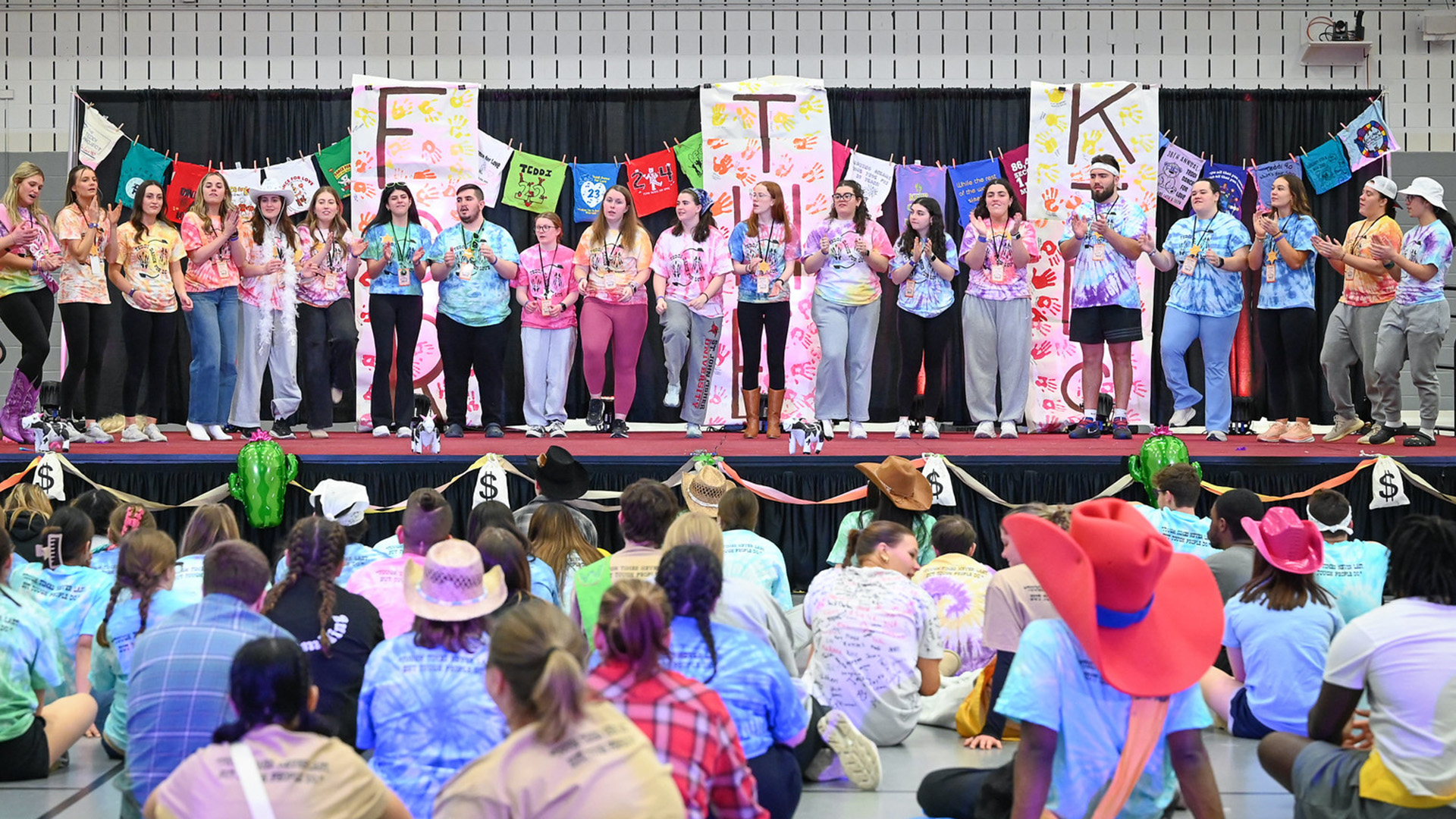 A row of dancers in various types of shoes during the Teddi Dance for Love.