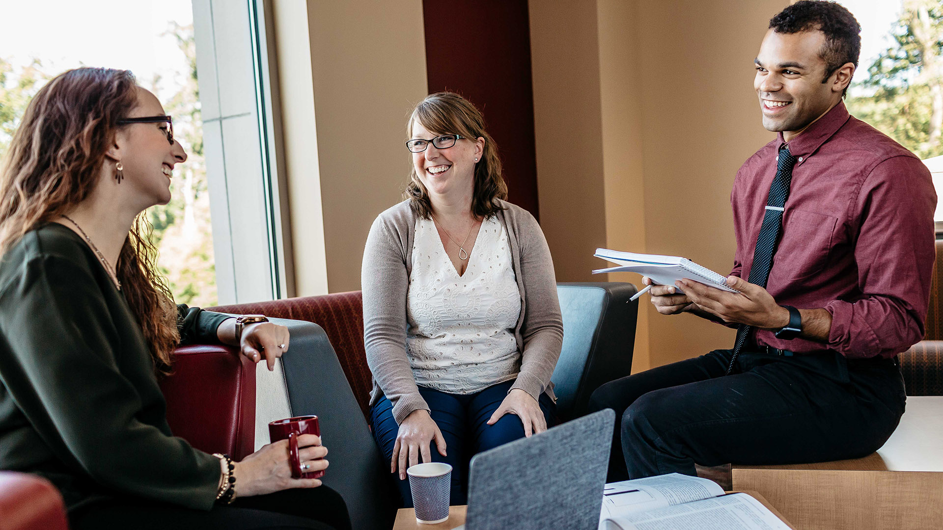 Three graduate students in a study session.