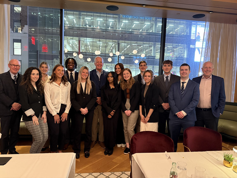 Group of alumni, staff, and students at a professional networking event