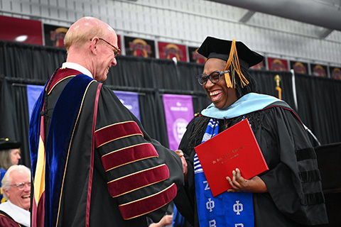 Celebrations at the Ed.D. hooding ceremony.