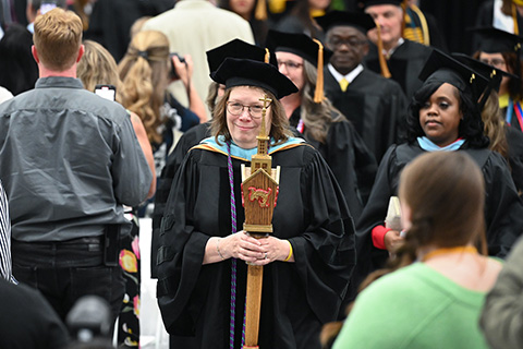 Faculty and students process together during the Commencement ceremony.