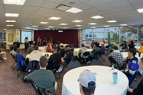 Special event in Gateway Midlevel with several people seated at tables.