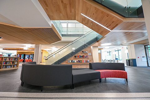 New arrivals shelving near modern seating in Lavery Library.