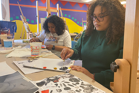 Two students painting