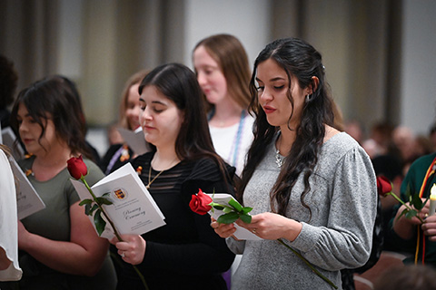 Graduating nursing students say the Nightingale Pledge to symbolize their commitment to the profession.