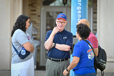 President Rooney talks with families at Bills Camp.