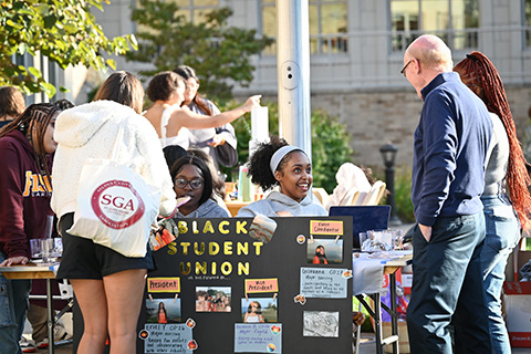 President Rooney attends the Inclusion Dinner event on campus.