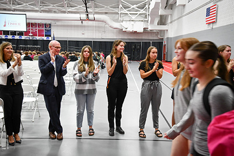 President Rooney claps for students during the Matriculation Ceremony.
