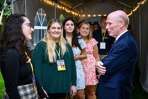 President Rooney visits with student leaders.