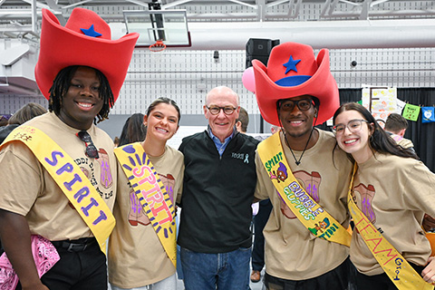 President Rooney participates in the Teddi Dance for Love with students.