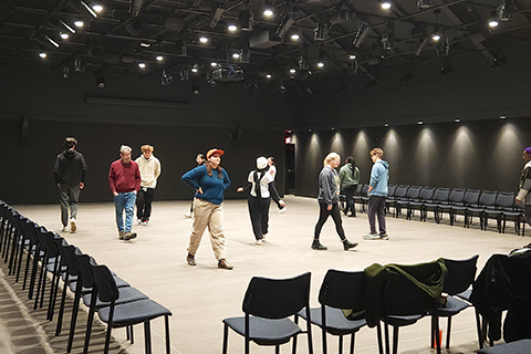 A group of students participating in a theater workshop