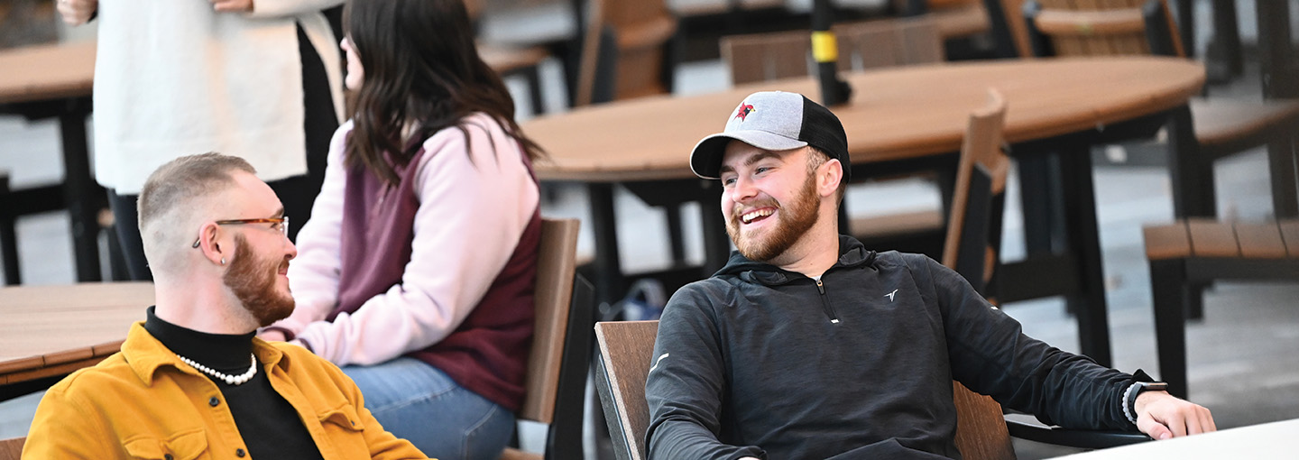 Students sit together on the Terrace at St. John Fisher University.