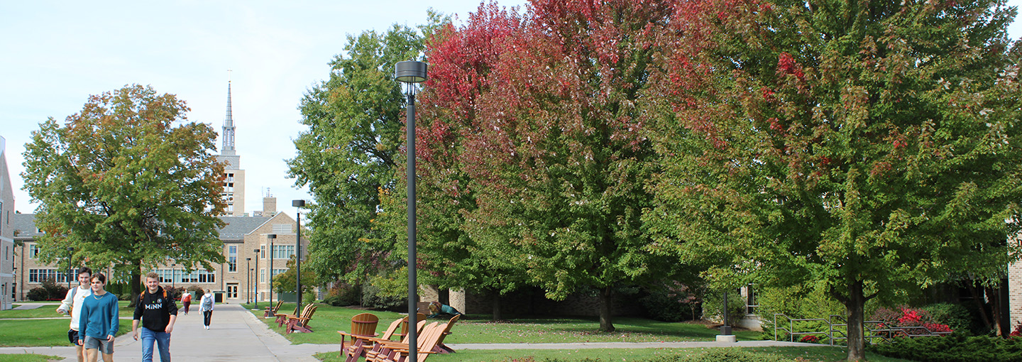 Students walk through Keough Quad as fall weather arrives