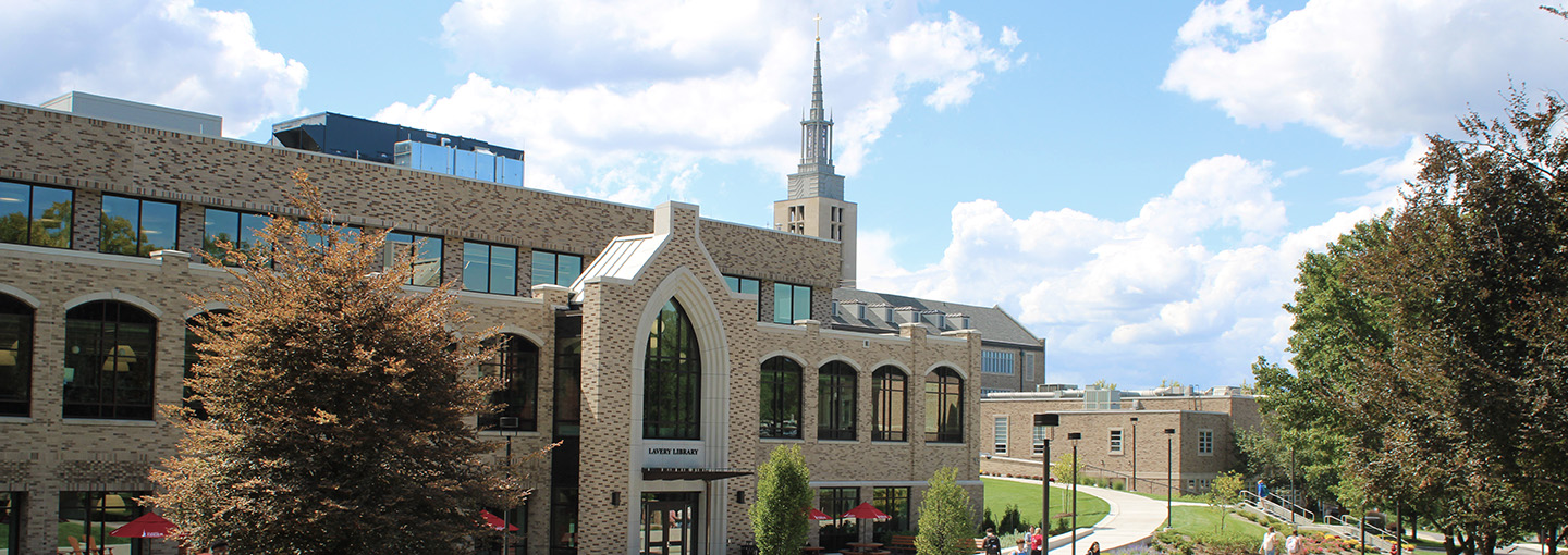 Lavery Library's LeChase Commons entrance, with the Kearney Hall steeple in the background.