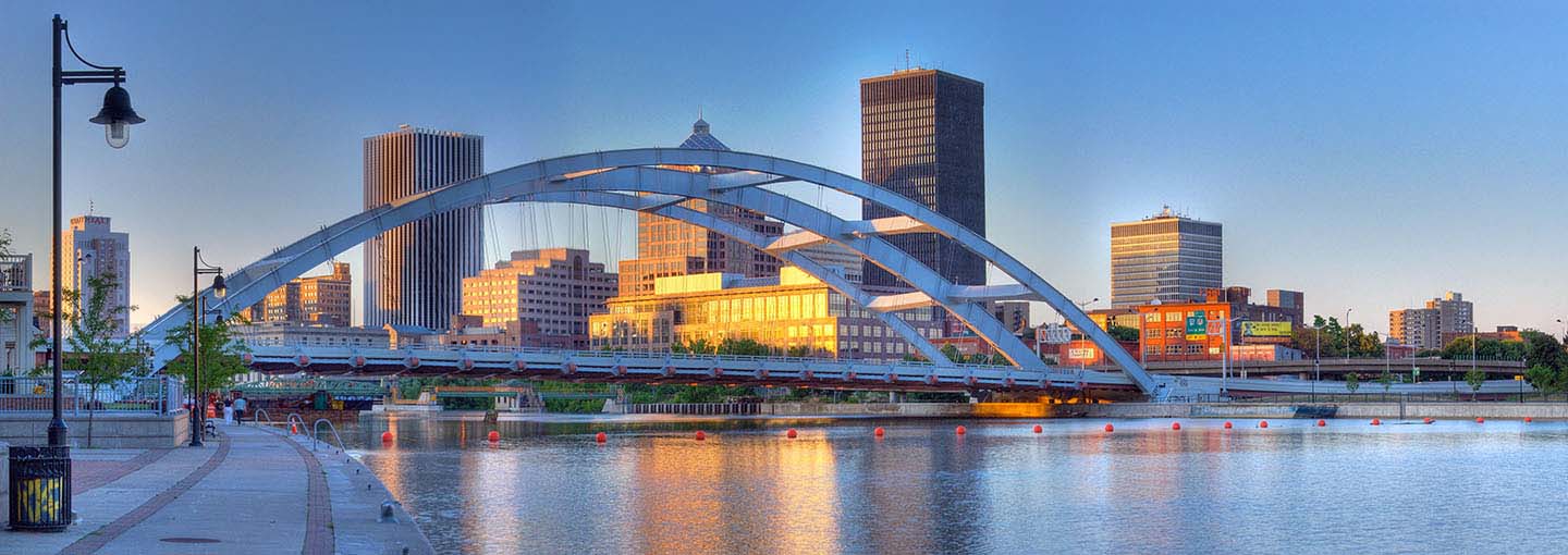 Rochester skyline and bridge at dusk.