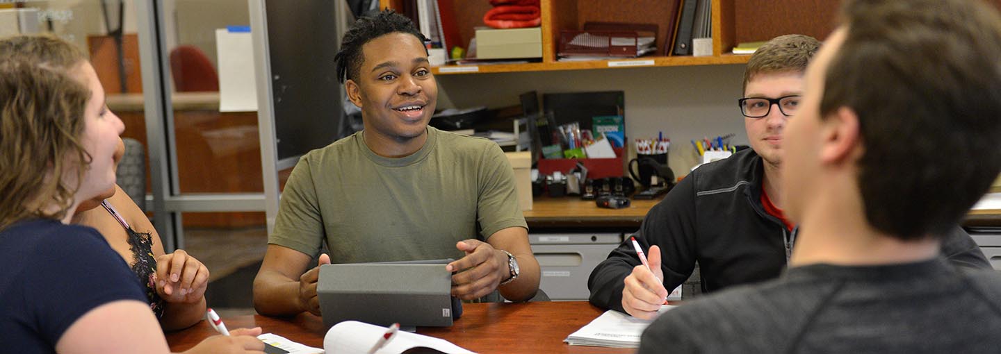 Students at table in SGA office.