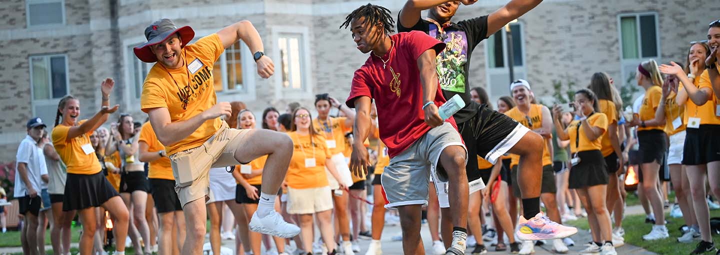 A group of students dancing and celebrating the start of the semester at Fisher.